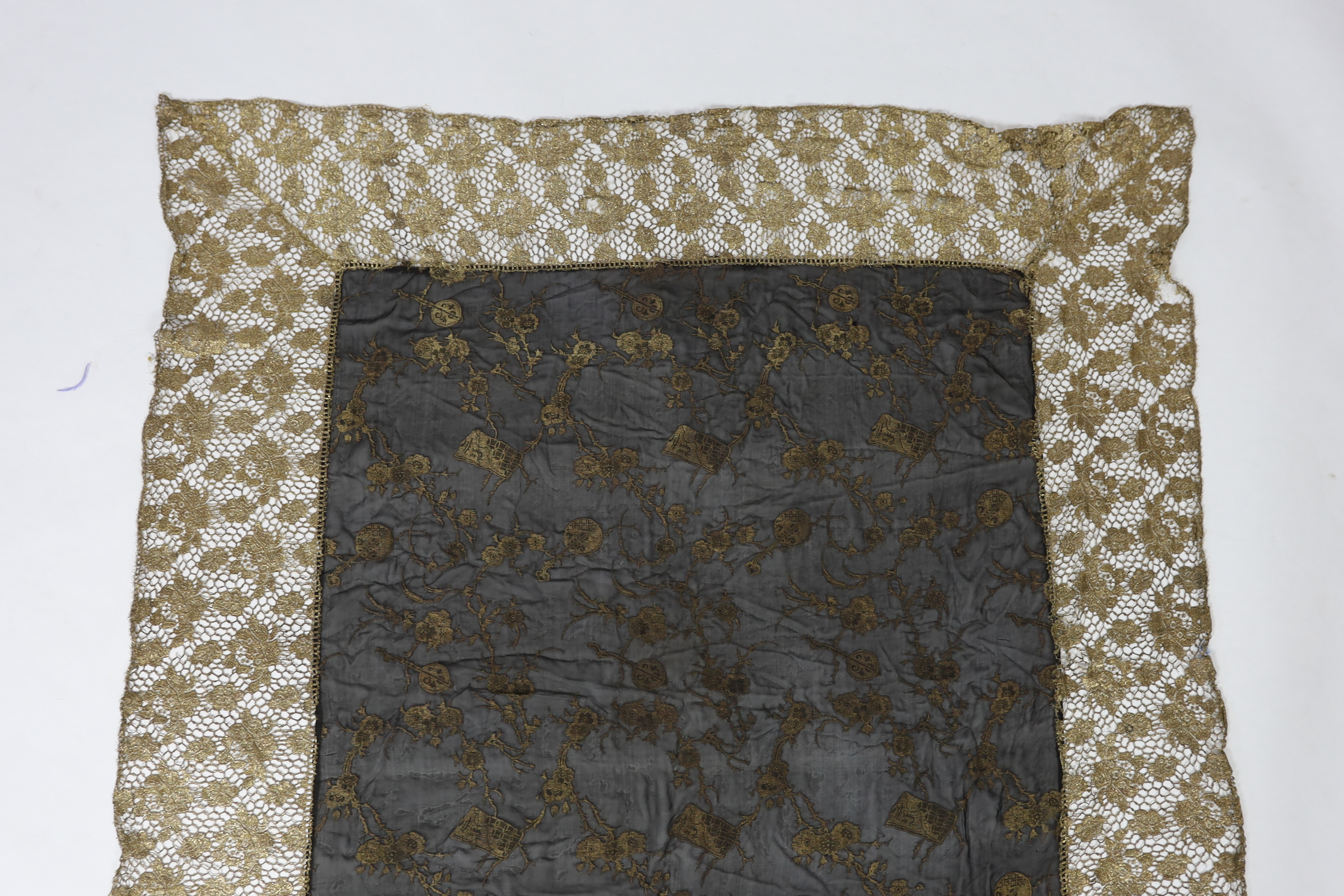 An unusual 1920's gold lace and black silk chiffon gold brocade boudoir cover, 140 x116cm